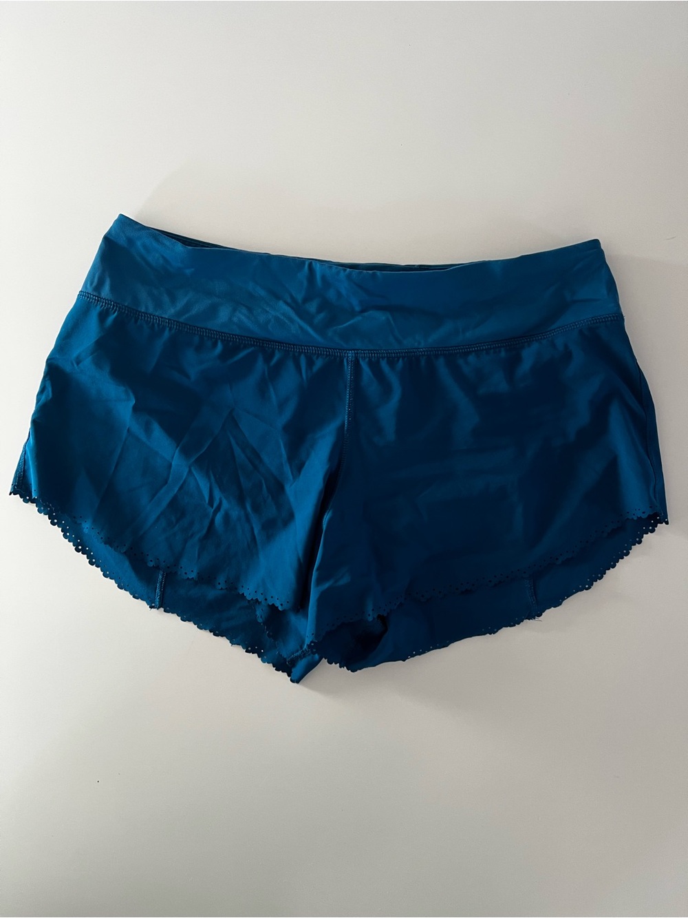 Womenโs Teal Activewear Short with trim and built-in underwear